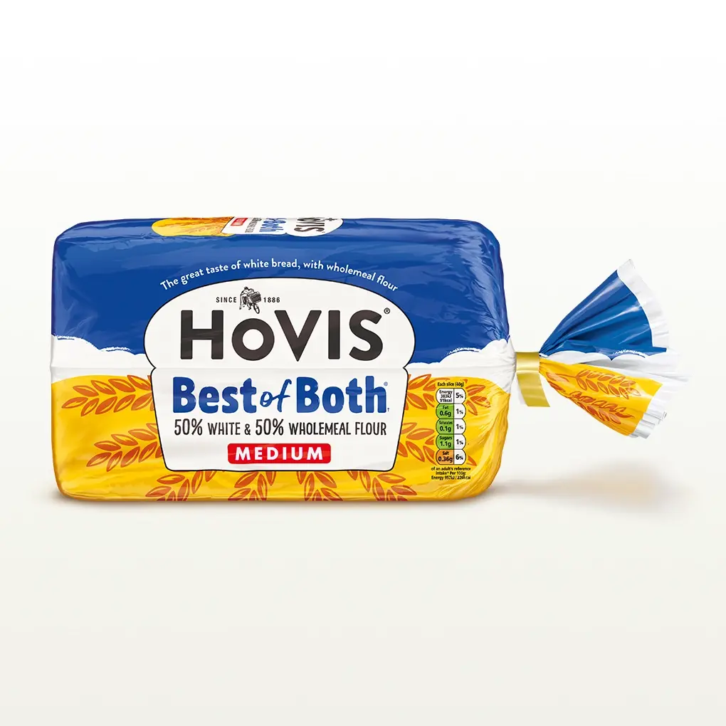 A Hovis Best of Both loaf medium sliced sits within a white back drop with a subtle shadow below the bread. 