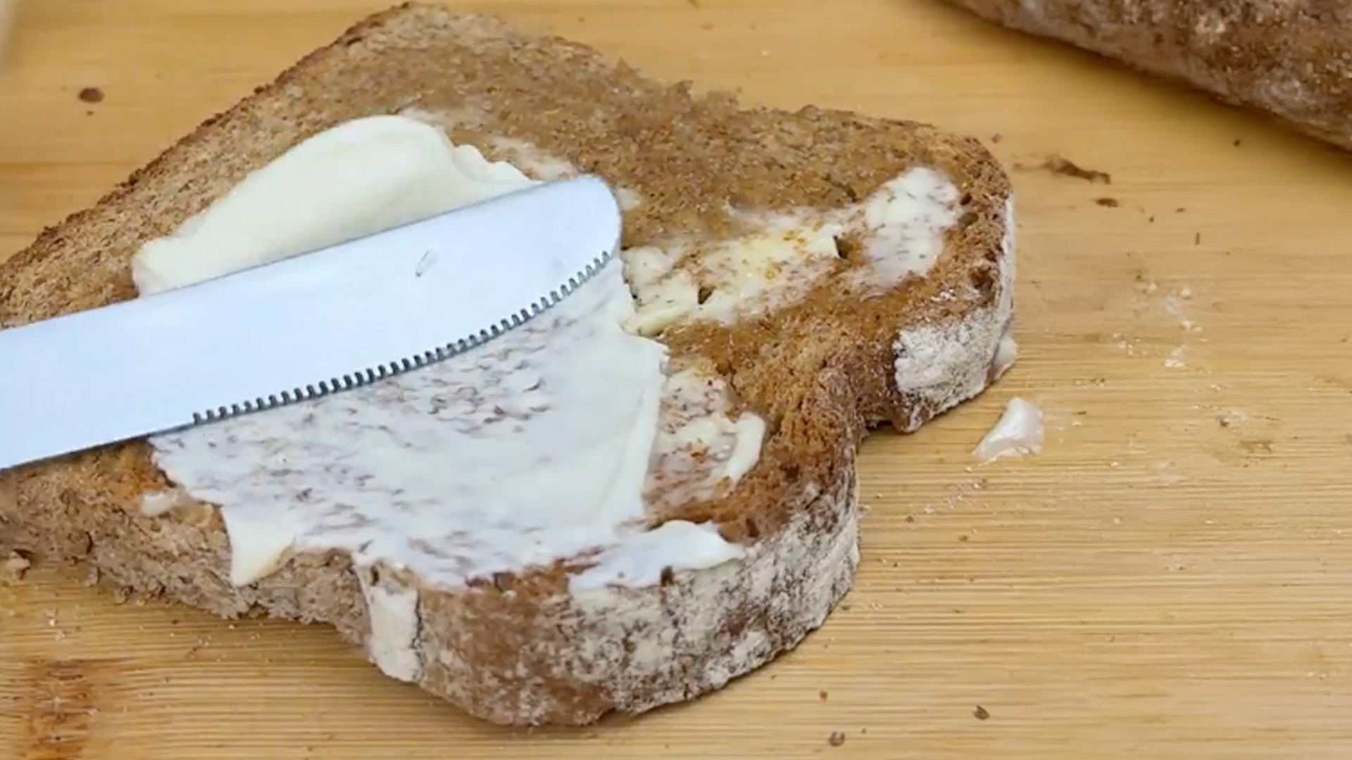 Someone spreading Mayonnaise on a lightly toasted slice of Hovis® Farmhouse Wholemeal