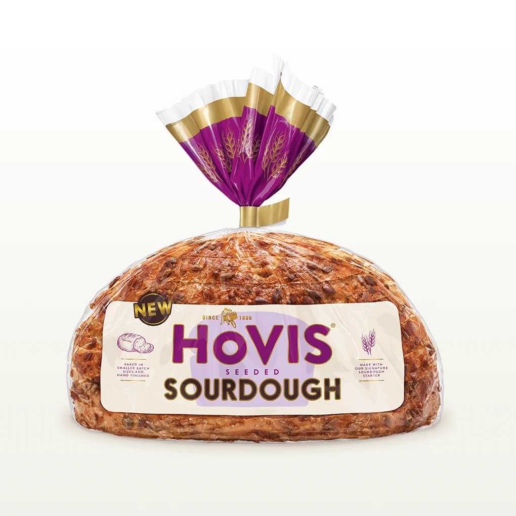 A loaf of hovis seeded sourdough sits in a cream background