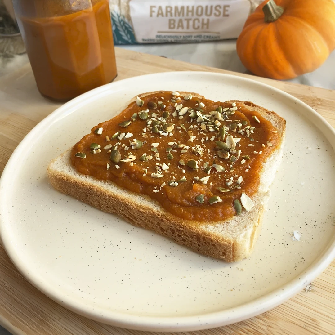 A slice of Hovis Farmhouse batch is covered in spice pumpkin butter
